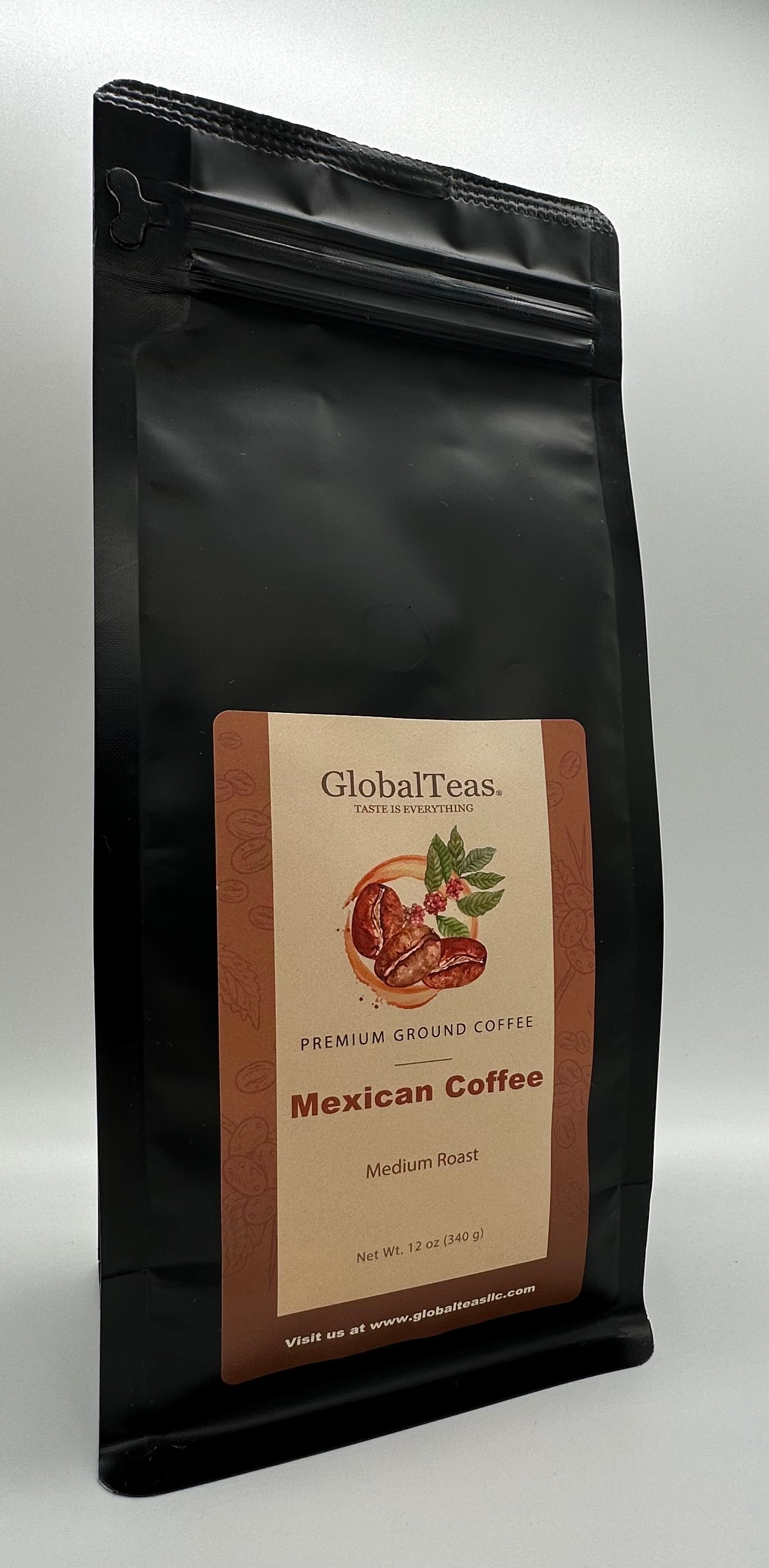 Black coffee bag labeled "GlobalTeas Mexican Coffee," featuring a medium roast description and coffee bean illustrations.