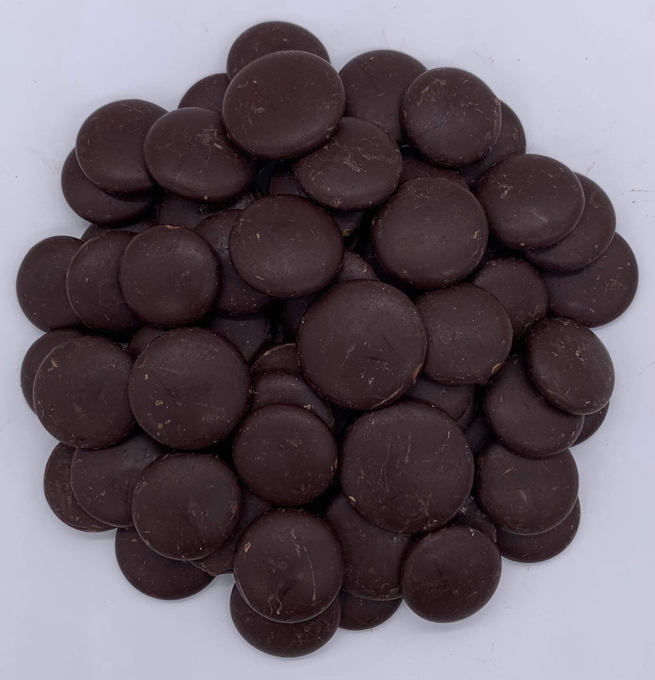 A mound of finely ground brown coffee powder with smooth texture on white background, ideal for organic coffees.