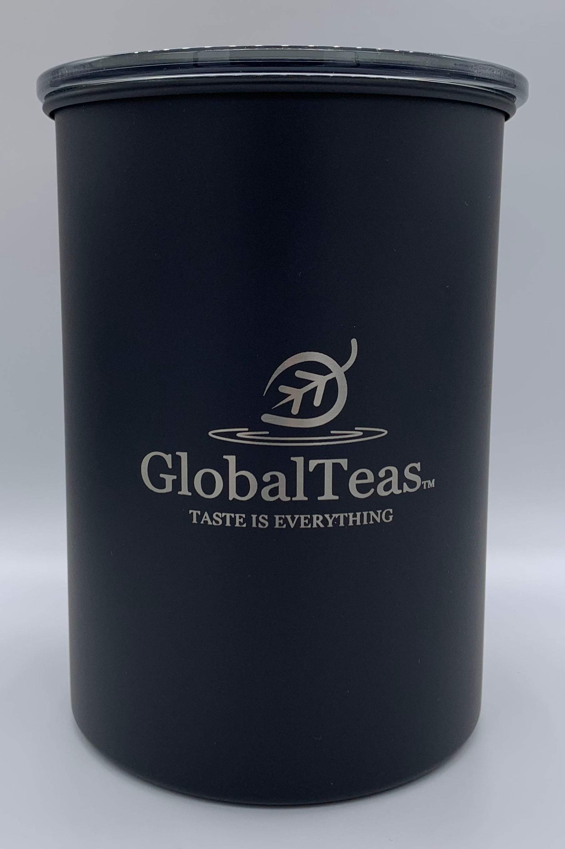 Black tea dispenser canister featuring the label Global Teas ideal for tea storage.