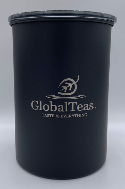 Black tea dispenser canister featuring the label Global Teas ideal for tea storage.