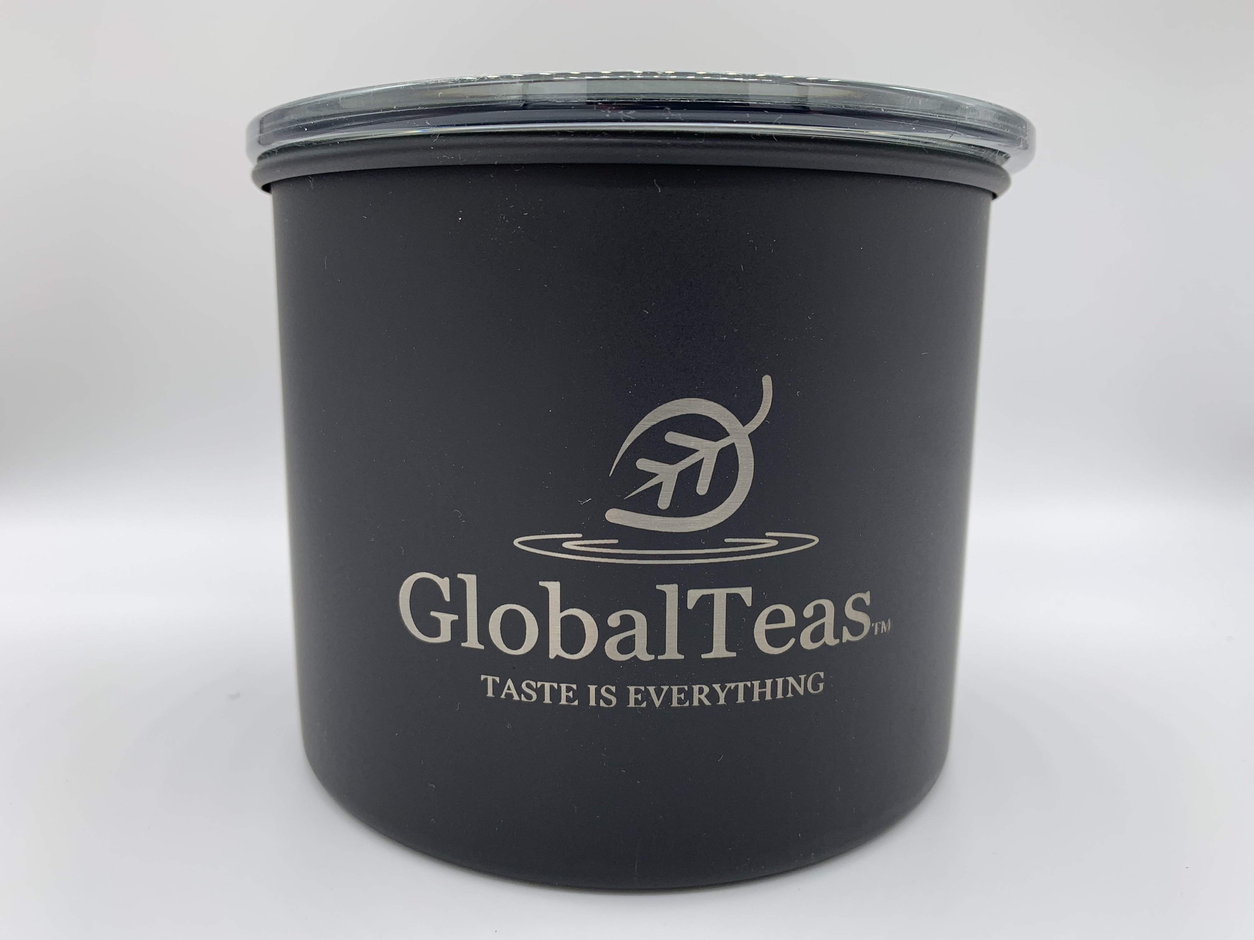 A sleek black container featuring the text Global Tea in a bold font.